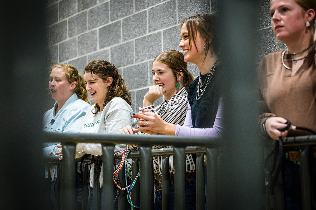 Northwest agriculture students watch from a sideline as their peers competed in the livestock show. (Photo by Todd Weddle/Northwest Missouri State University)